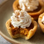 Mini Pumpkin Pies (Perfectly Spiced & Bite-Sized for the Holidays) 12 Bitten Mini Pumpkin Pie with Flaky Crust and Creamy Pumpkin Filling
