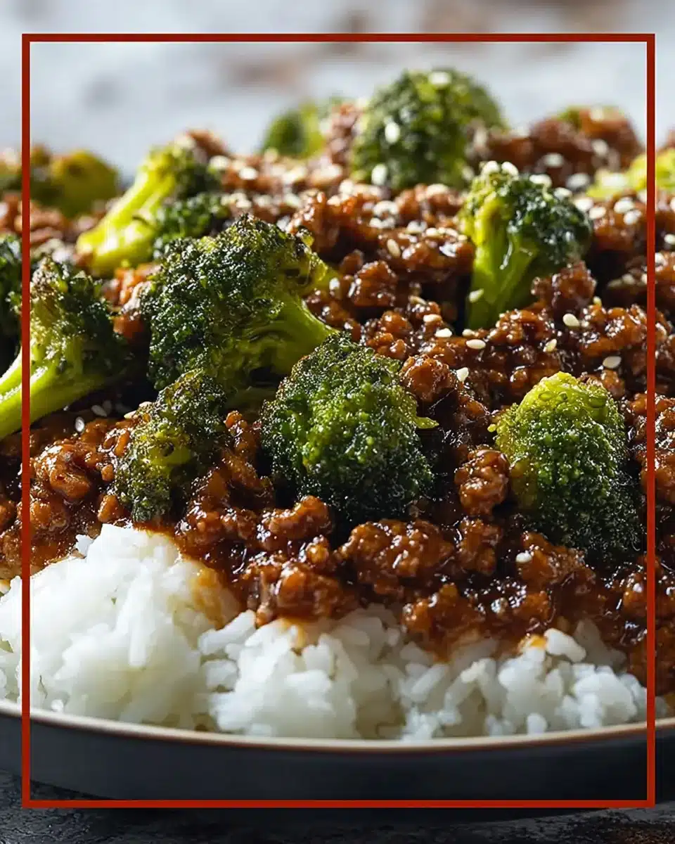 Honey garlic ground beef and broccoli stir-fry over white rice with sesame seeds and glossy garlic sauce