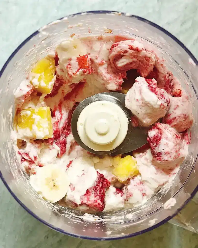 Fruit Smoothie Bowl Recipe: 5-Minute Strawberry Banana Bliss 8 Frozen fruit and yogurt inside a food processor before blending a smoothie bowl