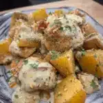 Garlic Parmesan Crockpot Chicken and Potatoes – Easy Comfort Dinner 11 Garlic parmesan chicken and potatoes with creamy sauce on a plate