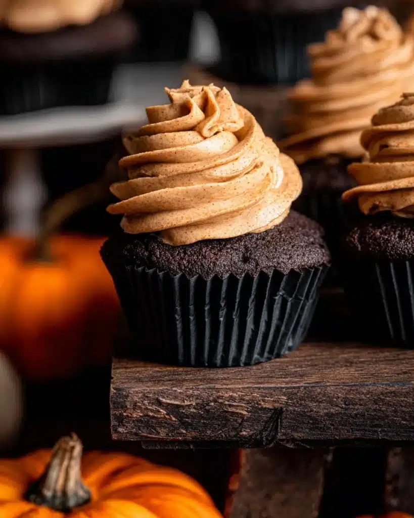 Chocolate Pumpkin Cupcakes – Festive Fall Treats 16 Close-up of chocolate pumpkin cupcake with spiced frosting swirl