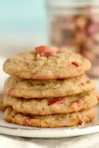 Brown sugar rhubarb cookies stacked with soft centers and golden crisp edges