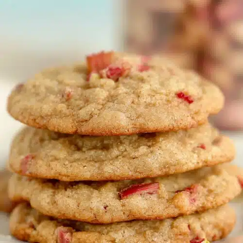 Brown Sugar Rhubarb Cookies That Are Soft, Chewy, and Irresistible 3 Brown sugar rhubarb cookies stacked with soft centers and golden crisp edges