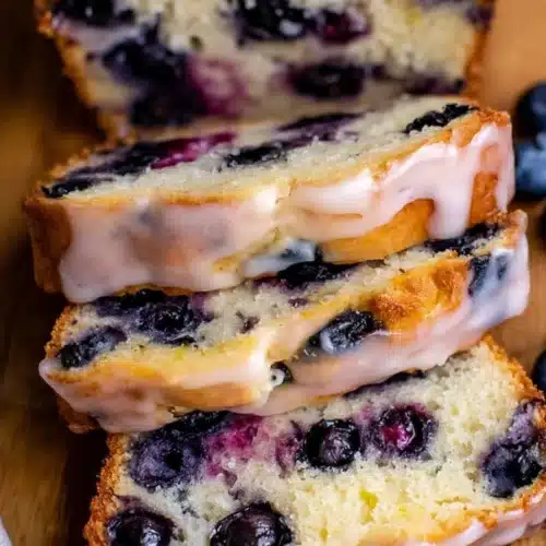 Lemon Blueberry Bread 3 Moist lemon blueberry bread slices with glaze and fresh blueberries