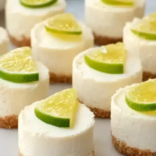 Mini margarita cheesecakes with lime slices on creamy no bake cheesecake bites