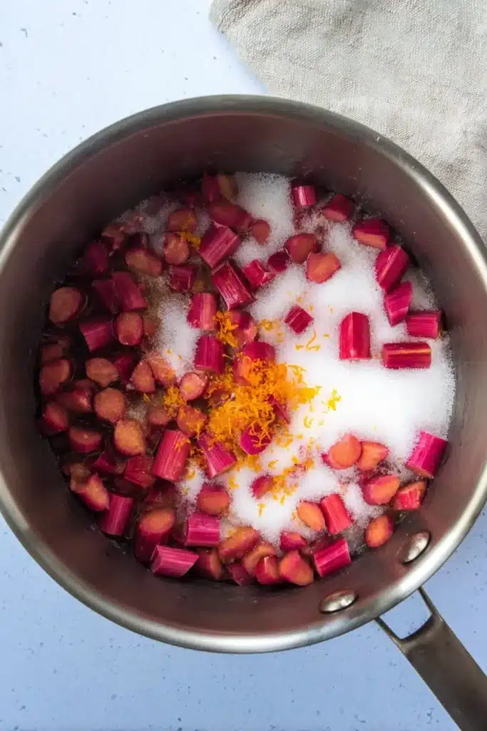 Rhubarb Ice Cream ingredients with chopped rhubarb sugar and zest