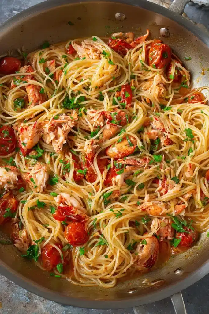 Buttered Lobster Pasta 4 Buttered Lobster Pasta tossed in tomato butter sauce in skillet
