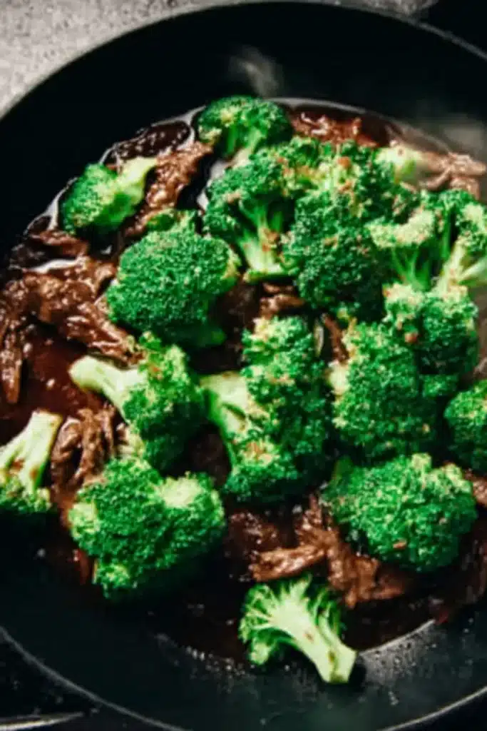 Chinese Beef and Broccoli served over white rice in a rustic bowl