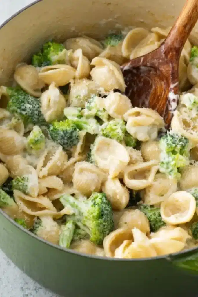 Creamy Broccoli Pasta 5 Creamy Broccoli Pasta being stirred in creamy Parmesan sauce