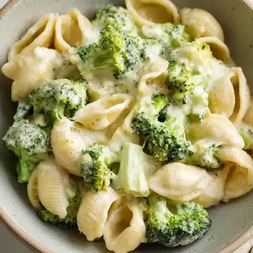 Creamy Broccoli Pasta 6 Creamy broccoli pasta with shell pasta and cheesy garlic sauce in a rustic bowl