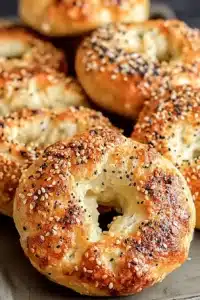Golden brown Greek Yogurt Bagels with sesame and poppy seed topping