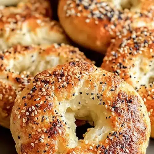 Golden brown Greek Yogurt Bagels with sesame and poppy seed topping