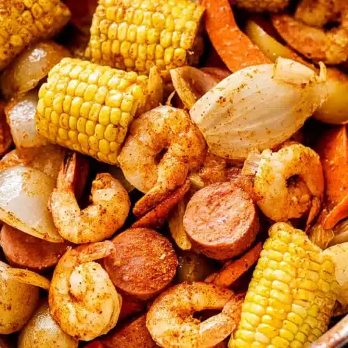 Grilled Shrimp Boil in Foil Packets 3 Grilled shrimp boil with sausage, potatoes, and corn in buttery Cajun seasoning