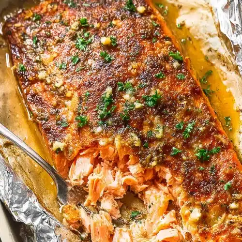 Oven baked salmon with garlic herb crust and flaky juicy texture