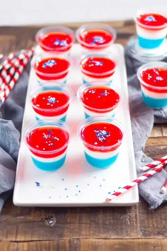 Festive Red White & Blue Jello Shots on a platter for Fourth of July