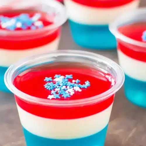 Red White & Blue Jello Shots with patriotic layers and star sprinkles