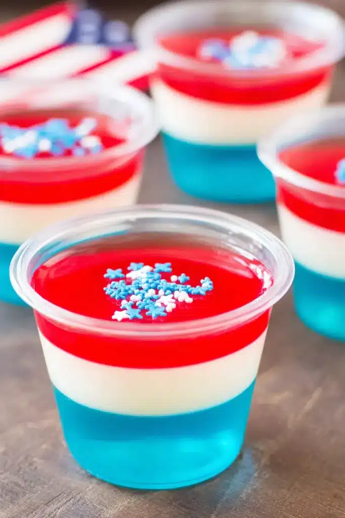 Red White & Blue Jello Shots with patriotic layers and star sprinkles