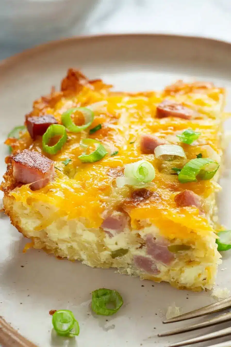 home 7 Hash Brown Egg Casserole slice with cheese ham and green onions