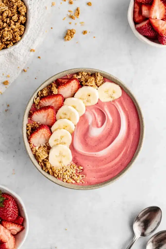 Strawberry Banana Smoothie Bowl 3 Strawberry Banana Smoothie Bowl topped with bananas strawberries and granola