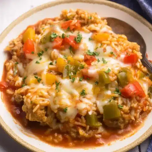 Stuffed Pepper Casserole 5 Stuffed pepper casserole with melted cheese, rice, sausage, and bell peppers